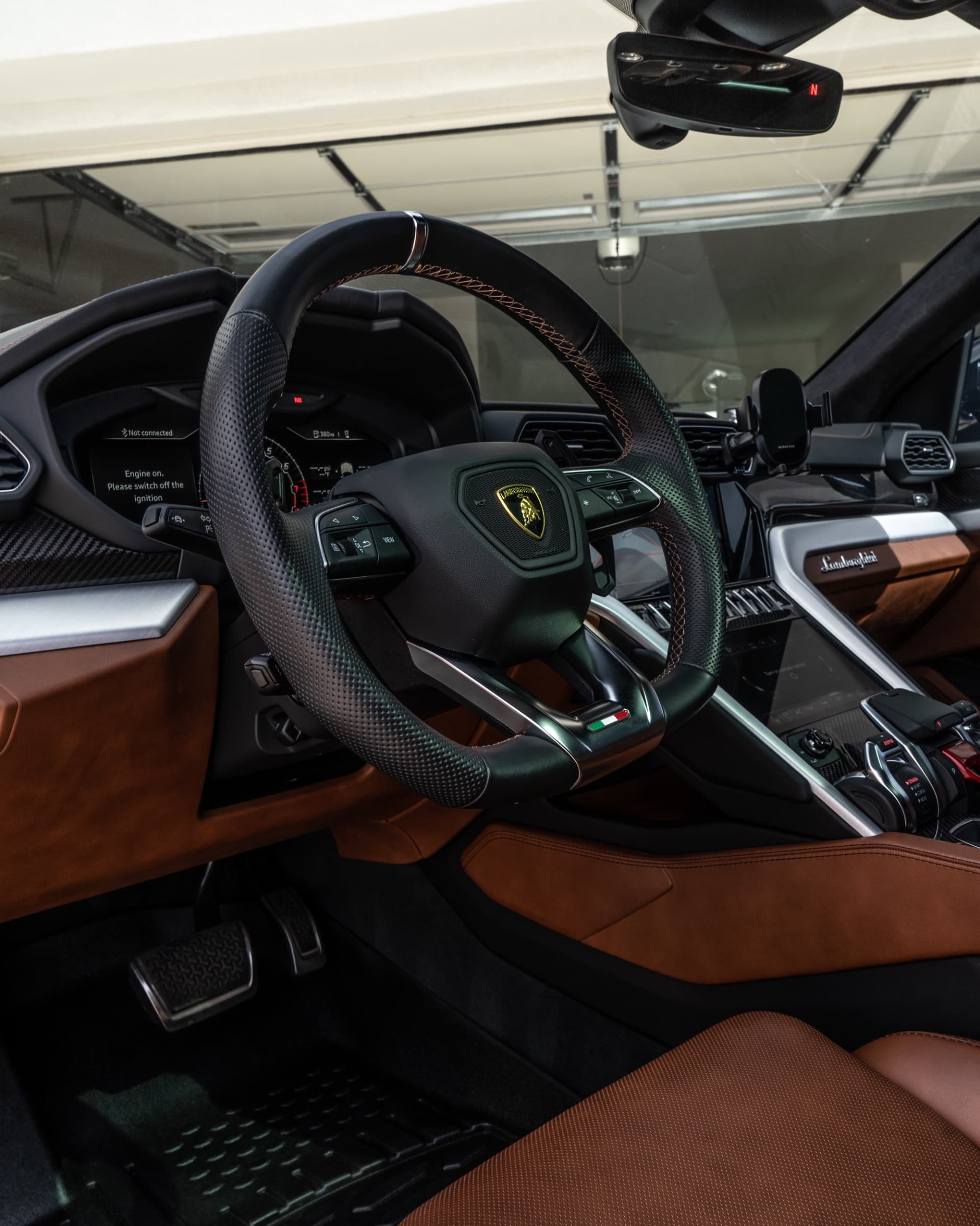 Lamborghini Urus tan leather interior after a mobile interior detail by Spotless Detail in Gilbert, AZ
